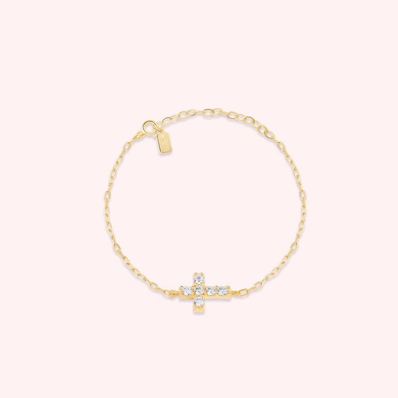 Bracelet orné d'une croix strassée